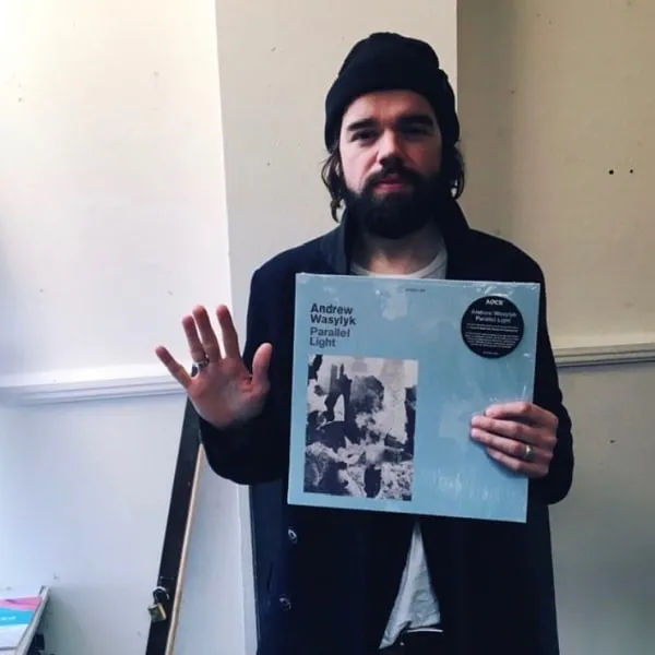 Andrew Wasylyk hold vinyl of his last released album 