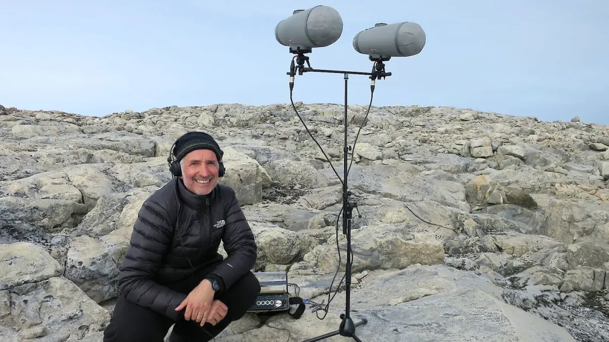 Philip Samartzis recording sounds in the field near Casey station